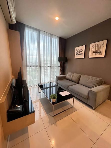 living room and bedroom of อัพเอกมัยคอนโดมิเนียม