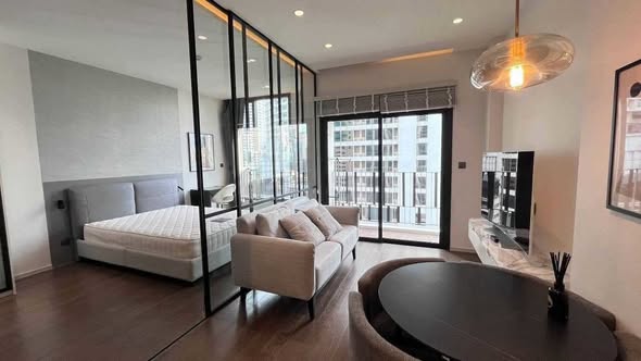 bedroom and living room of MUNIQ Sukhumvit 23