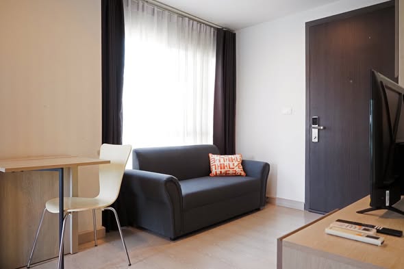 bedroom and living room of คอนโด Niche id