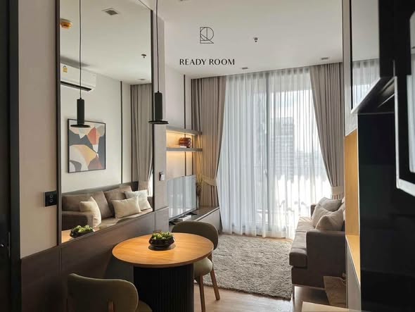 living room and bedroom of Noble Around Ari