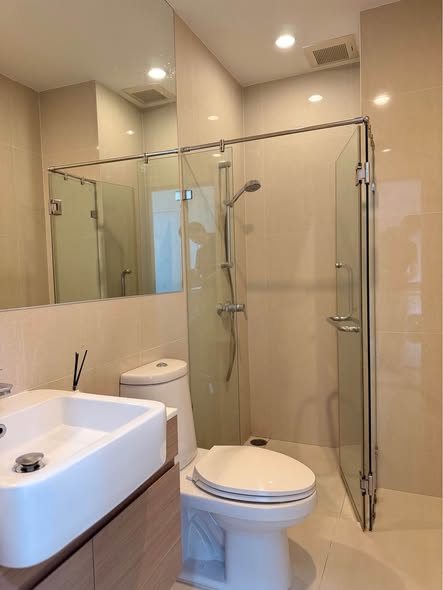 room interior and bathroom of Noble Revolve Ratchada 1