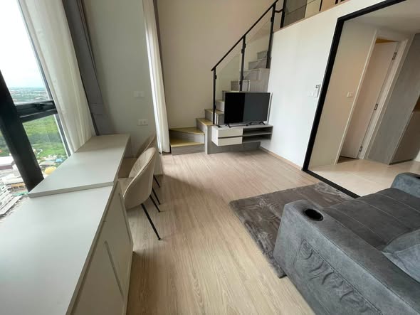 living room of Origin Plug & Play Nonthaburi Station