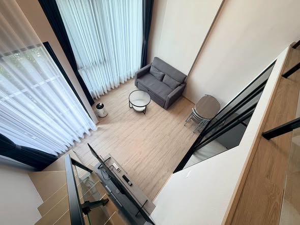 living room of Origin Plug & Play Nonthaburi Station