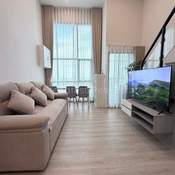 living room of Origin Plug & Play Sirindhorn Station