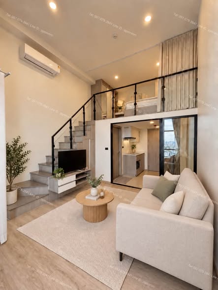 living room of Origin Plug & Play Sirindhorn Station
