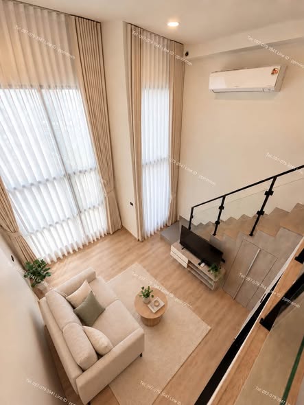 living room of Origin Plug & Play Sirindhorn Station