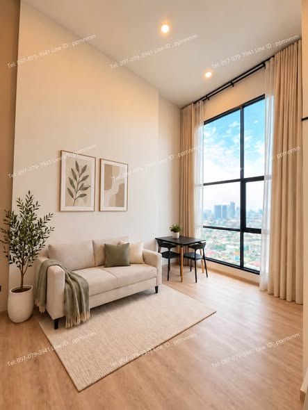 living room of Origin Plug & Play Sirindhorn Station