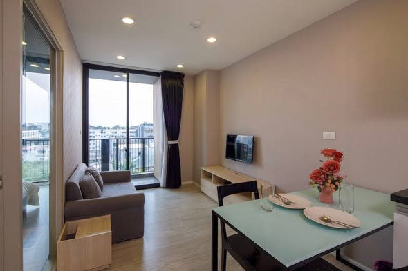 living room and bedroom of Palm Springs Nimman (Parlor)