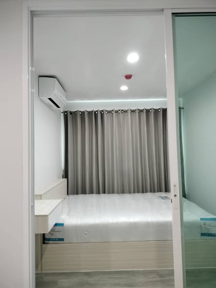 bedroom and room interior of RYE Talat Phlu
