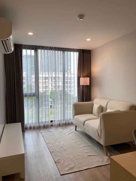 living room and bedroom of S Condo Sukhumvit 50