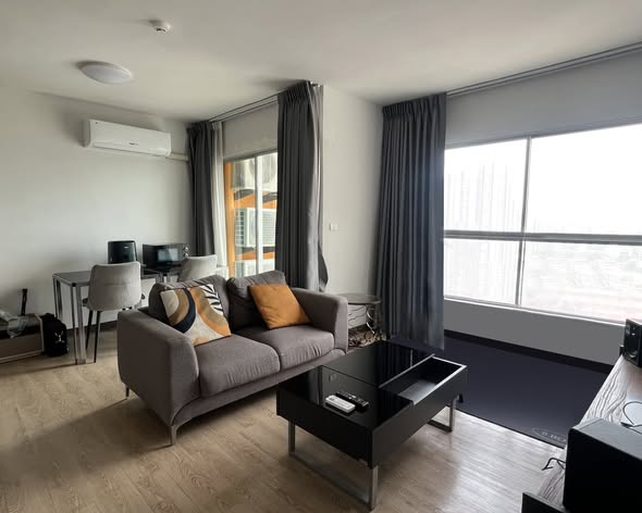 bedroom and living room of S&S Sukhumvit Condominium