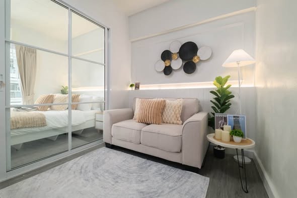 bedroom and living room of Studio One Condo