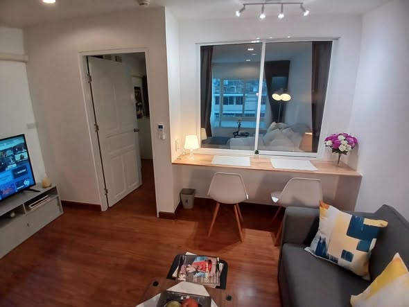 living room and bedroom of Surawong City Resort