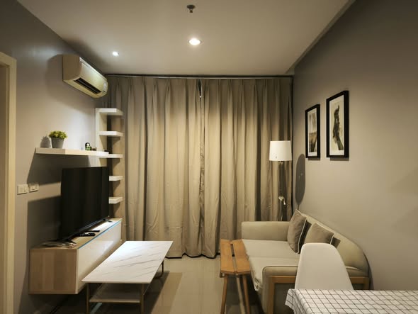 bedroom and living room of TC-Green Condominium