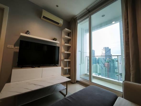living room and bedroom of TC-Green Condominium