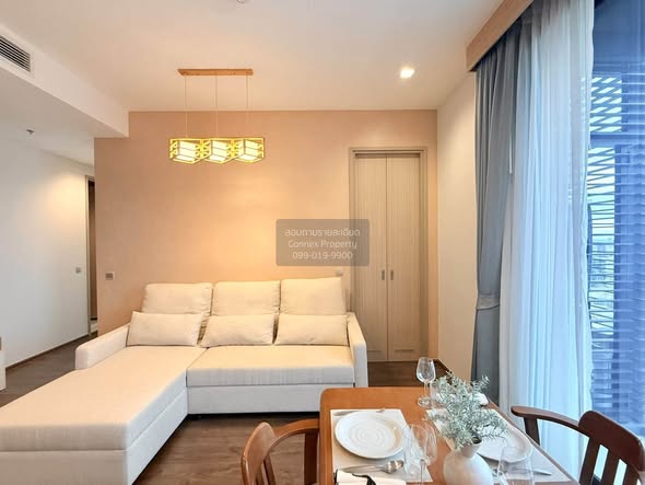 living room and bedroom of The Address Siam