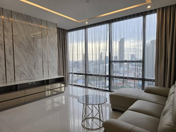 bedroom and living room of The Bangkok Sathorn
