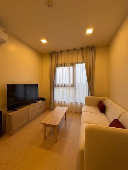 bedroom and living room of The Base Urban Rama9