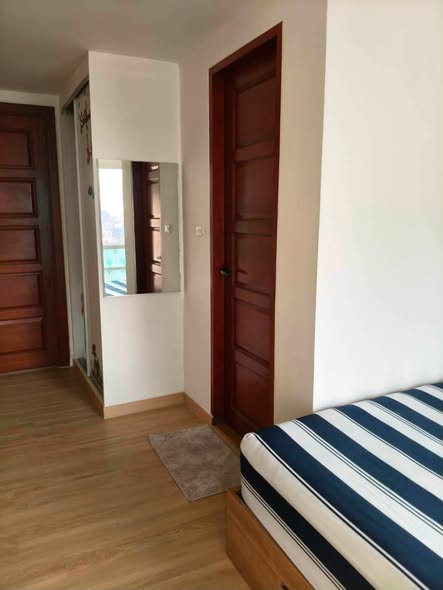 bedroom of The Emerald Hotel