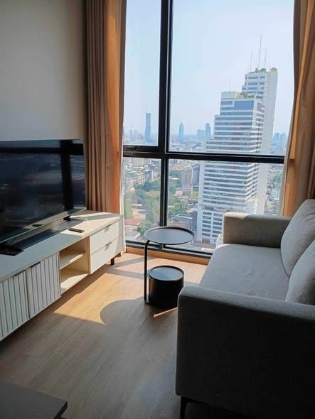 bedroom and living room of The Issara Sathorn (ดิ อิสสระ สาทร)