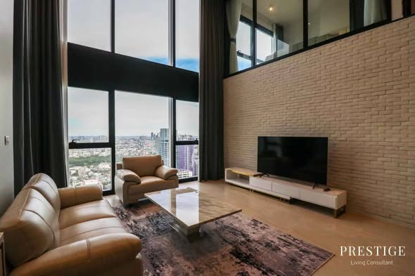 living room and bedroom of The Lofts Silom by Raimon Land