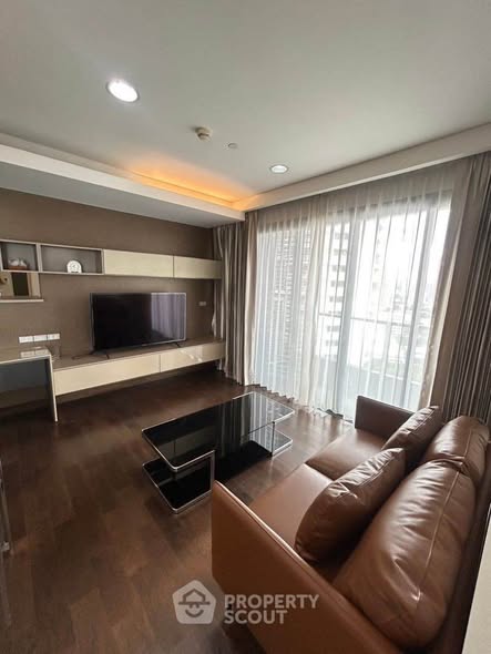 living room and bedroom of The Lumpini 24