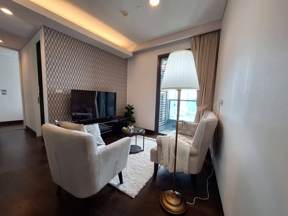 living room and bedroom of The Lumpini 24