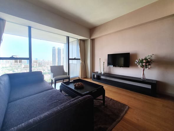 bedroom and living room of The Met Condominium