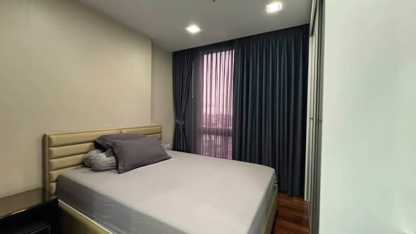 bedroom of The Metropolis Samrong
