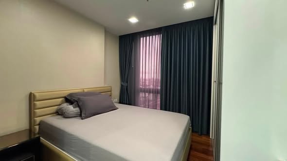 bedroom of The Metropolis Samrong