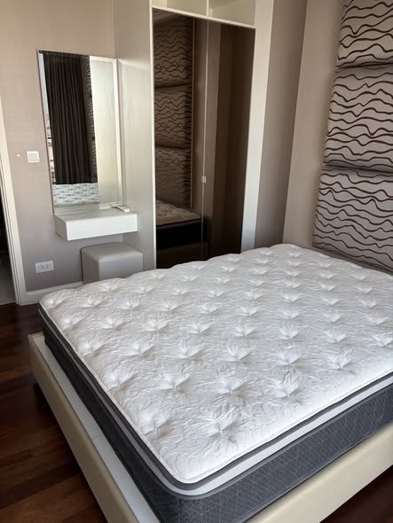bedroom of The Metropolis Samrong