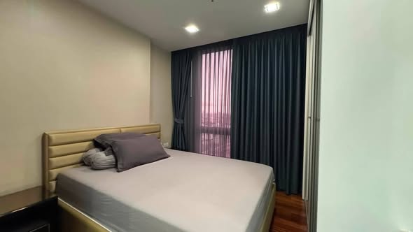 bedroom of The Metropolis Samrong