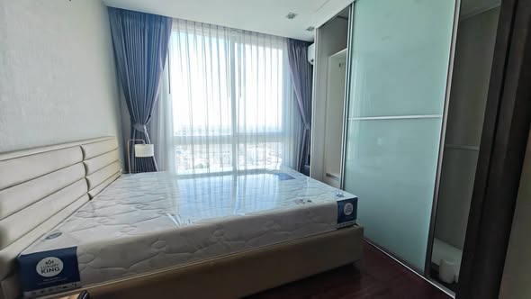 bedroom of The Metropolis Samrong