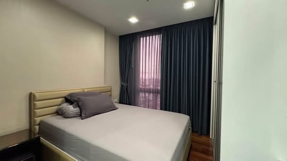 bedroom of The Metropolis Samrong