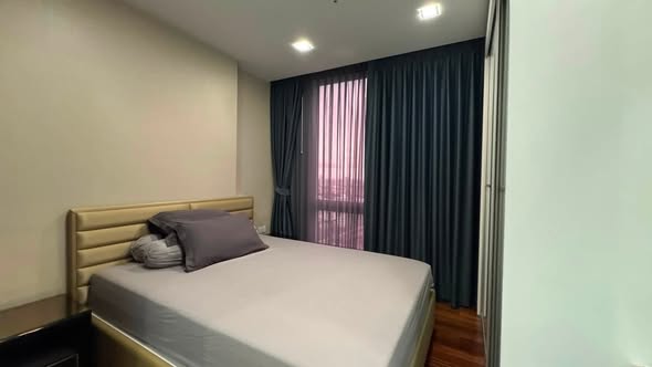 bedroom of The Metropolis Samrong