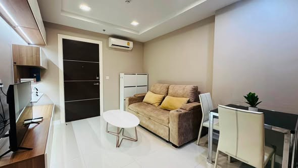 bedroom and living room of The Metropolis Samrong