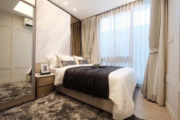 bedroom of The Moment Ratchada 19