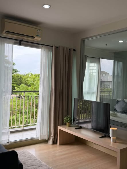 living room and bedroom of The Parkland Srinakarin Lakeside