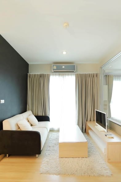 living room and bedroom of The Parkland Srinakarin Lakeside