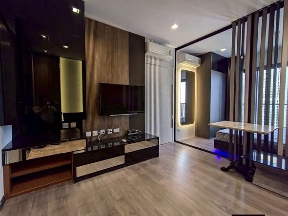 bedroom and living room of The Politan Rive