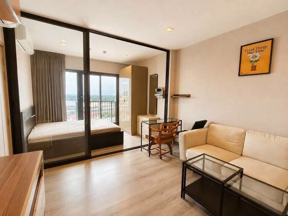 bedroom and living room of The Politan Rive