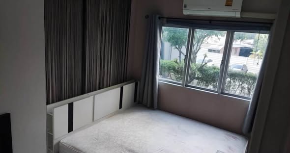 bedroom of The Privacy Ladprao – Sena