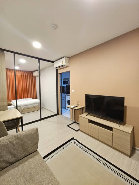 living room and bedroom of The Privacy S101
