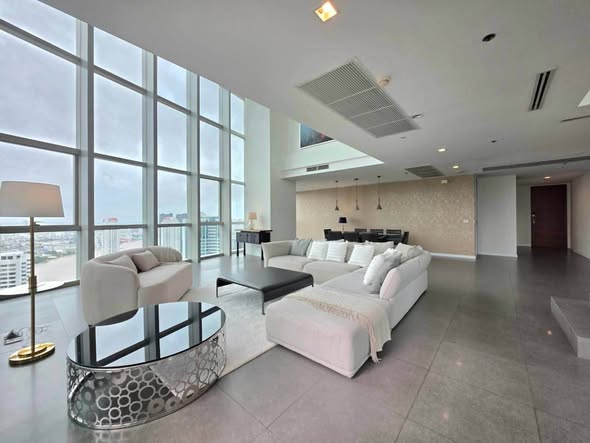 bedroom and living room of The River Condominium