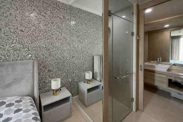 bedroom and bathroom of The Riviera Jomtien