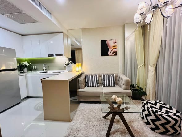 bedroom and living room of The Riviera Jomtien