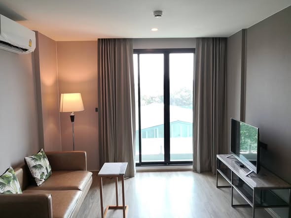 bedroom and living room of The TEAK Sukhumvit 39