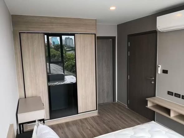 bedroom and room interior of The TEAK Sukhumvit 39