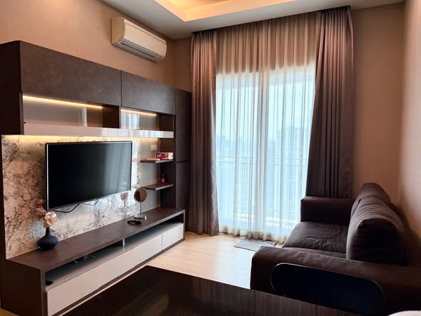 living room and bedroom of Thru Thong Lor