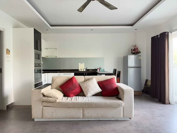 living room and bedroom of Tudor Court Condominium